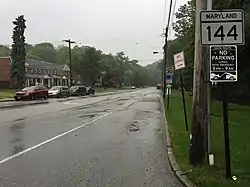 View east along 5500 block of Frederick Avenue in Baltimore, with rowhouses in Westgate to the left
