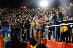Image 28Ágatha Bednarczuk embraces the home crowd after the 2016 final. (from Beach volleyball at the Summer Olympics)