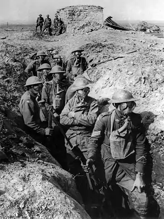 Image 2Poison gas in World War IPhoto credit: Frank HurleyA group of Australian infantry wearing Small Box Respirators (SBRs) at the Third Battle of Ypres in September 1917. After the introduction of poison gas in World War I, countermeasures were developed. SBRs represented the pinnacle of gas mask development during the war, a mouthpiece connected via a hose to a box filter (hanging around the wearer's neck in this picture), which in turn contained granules of chemicals that neutralised the gas. The SBR was the prized possession of the ordinary infantryman; when the British were forced to retreat during the German Spring Offensive of 1918, it was found that while some troops had discarded their rifles, hardly any had left behind their respirators.More featured pictures