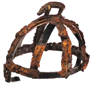 Colour photograph of the Benty Grange helmet, which has a freestanding boar atop its crest