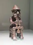 A statuette of a seated man