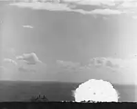 Shot Charlie, the second of three test explosions. USS Atlanta is moored to the left of the blast, with her bow pointing to the left