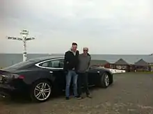 Dr Jeff Allan and his son Ben Cottam-Allan having completed their journey from Lands End to John o' Groats set off for the return journey in their Tesla electric car.