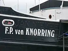 Side of the ship, with its original name painted over