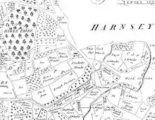 A single large house stands near a road running north–south. A small village stands to the northwest of the house, between two rivers.