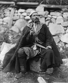 Old peasant with dagger and long smoking pipe, Mestia, Svanetia, Georgia (Republic)