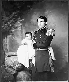 Photo of Zintkála Nuni at 4 months old, held by her adoptive father, General Leonard Colby.