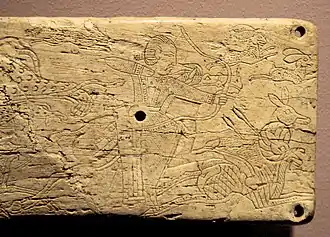 Hunters in an ivory plaque from Takht-i Sangin, with design comparable to the hunting scenes of the Orlat plaques.