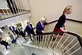 Secretary of State John Kerry climbs up the stairs of the building