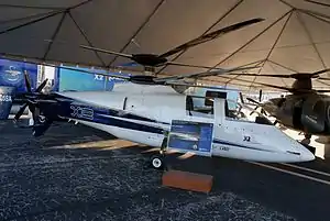 Sikorsky X2  Powered rotor, pusher propeller, no wings.