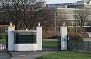 Entrance gate with the D10 building behind