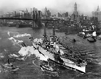Hyperboloid mast towers were on the USS Arizona, a view from the Manhattan Bridge on the East River, in New York City, December 25, 1916.